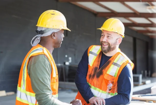 Two workers chatting